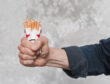 close-up-man-s-hand-crushing-packet-cigarette